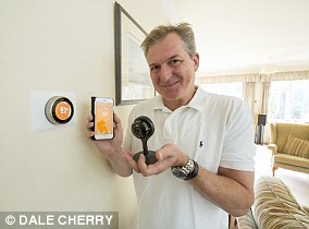 Fan: Aivars King with his Nest app and security camera