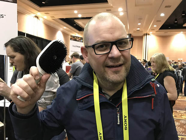 Dave Snelling holding a hair brush