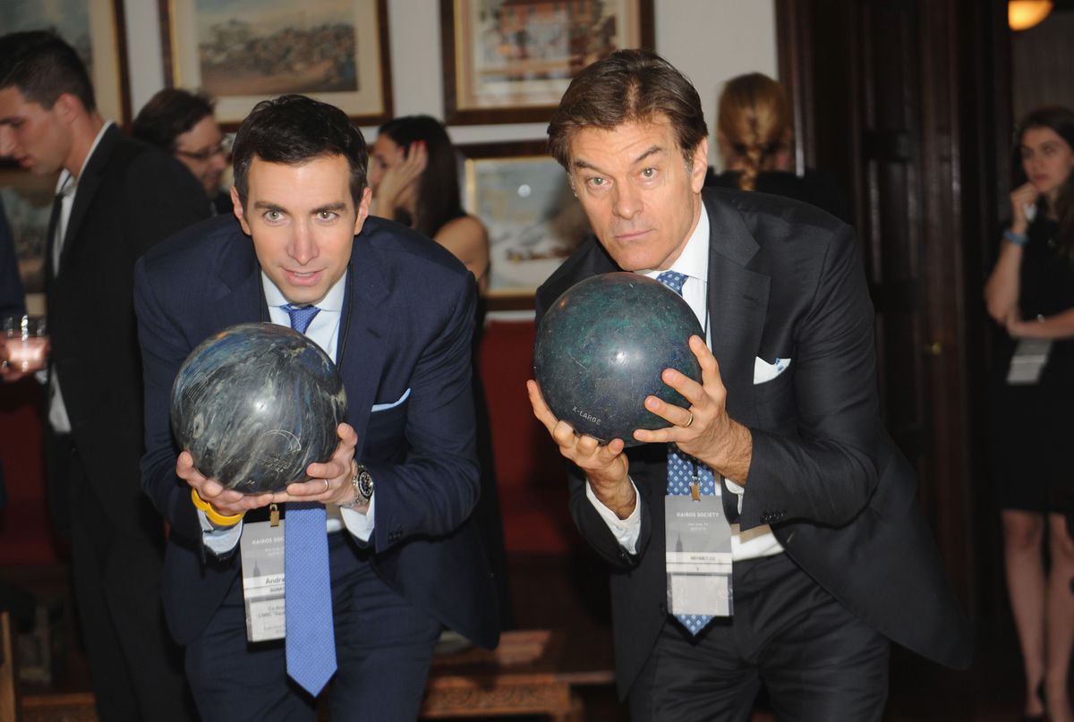 CNBC Squawk Box Co-Anchor Andrew Sorkin (L) and Dr. Mehmet Oz bowling before the Kairos Global Summit's welcome dinner at the Rockefeller Estate.